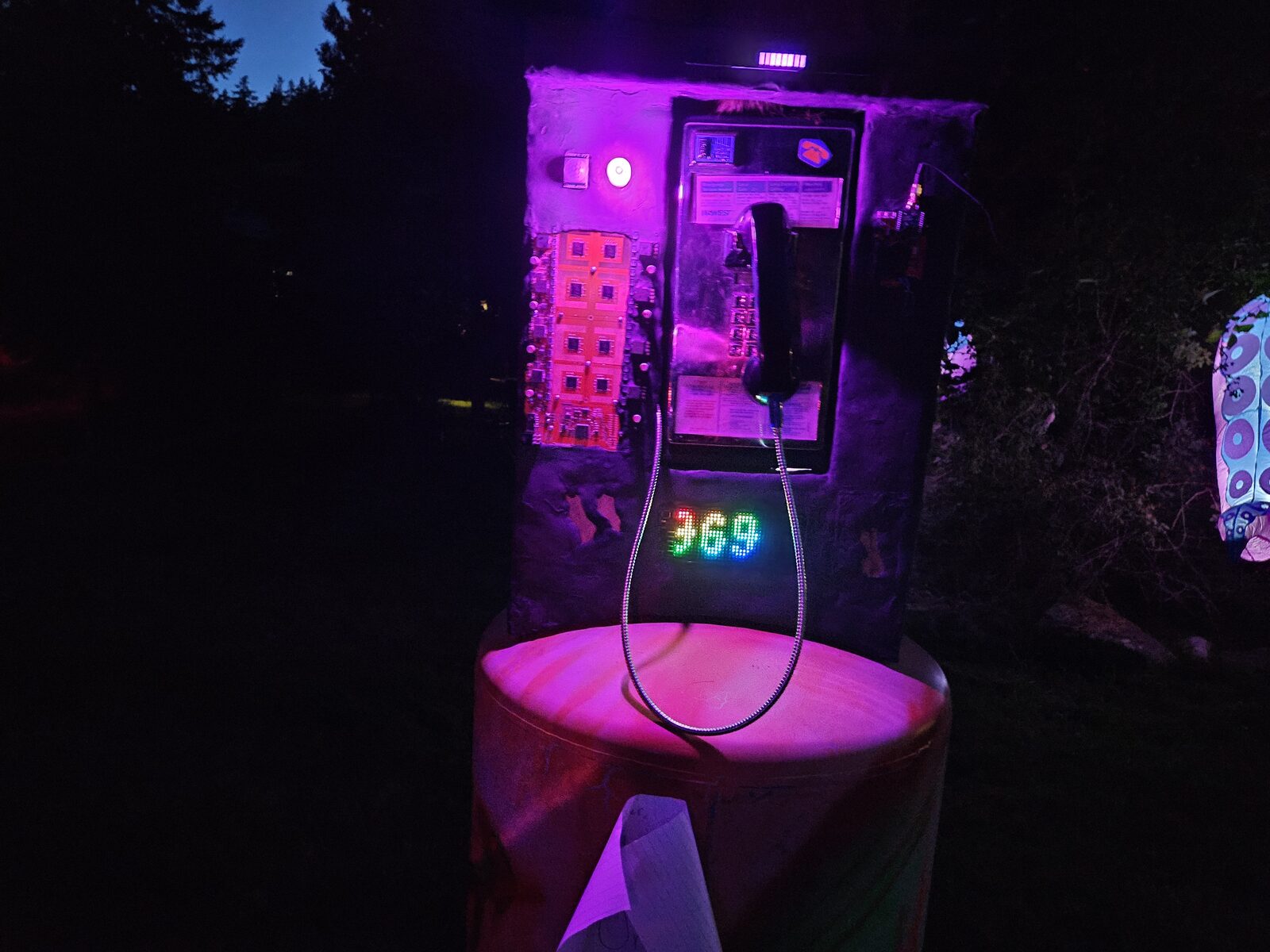 The phreaker payphone art installation, a circuit-board collage with an LED matrix reading '969' and a handset.